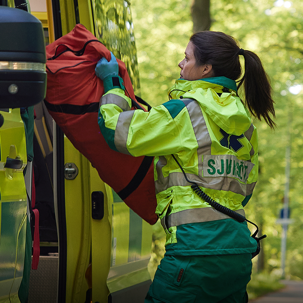 Paramedic next to an ambulance