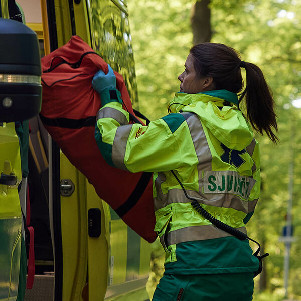 Paramedic next to an ambulance