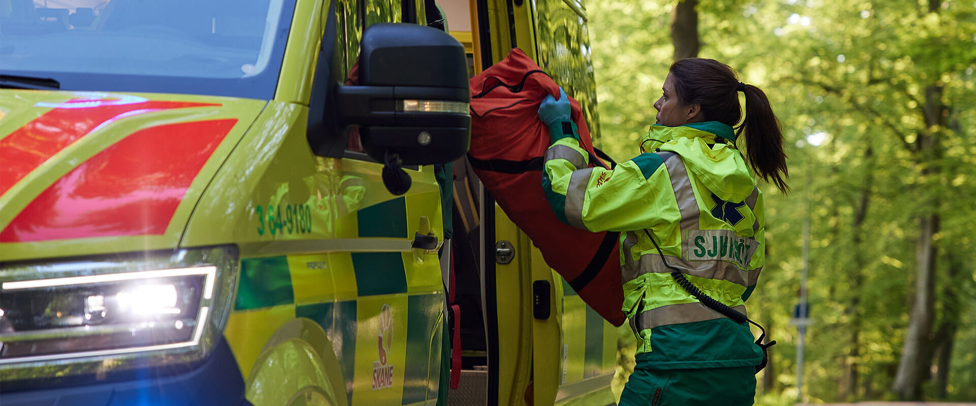 Paramedic next to an ambulance